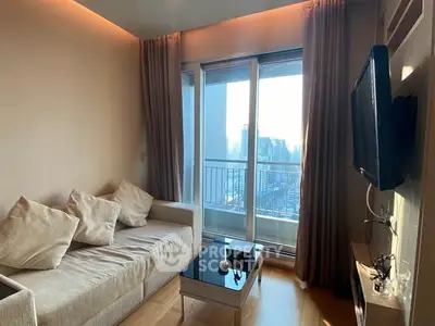 Modern living room with city view, featuring a cozy sofa and wall-mounted TV, perfect for urban living.