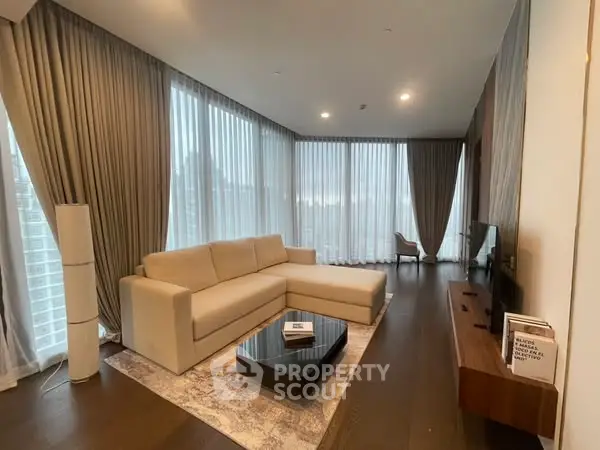 Luxurious living room with floor-to-ceiling windows and elegant decor