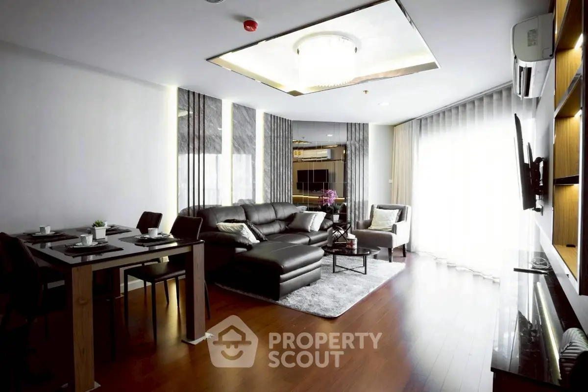 Modern living room with sleek furniture and elegant lighting