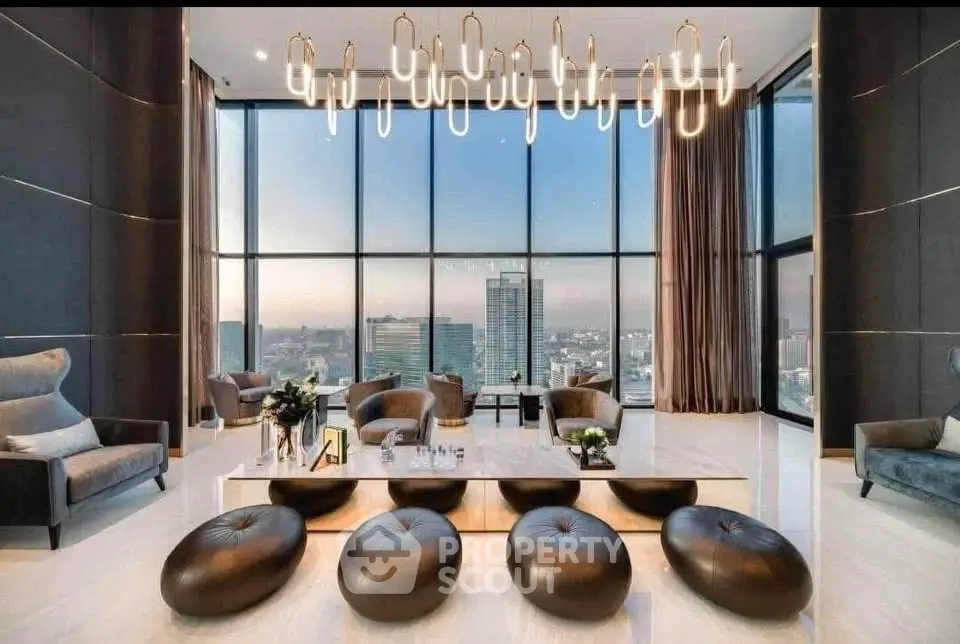 Luxurious modern living room with panoramic city views and elegant chandelier