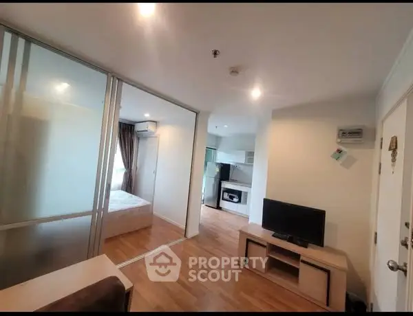 Modern apartment interior with open layout and wooden flooring