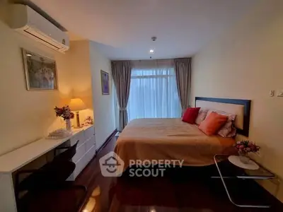 Cozy bedroom with elegant decor and natural light, featuring a comfortable bed and stylish furnishings.