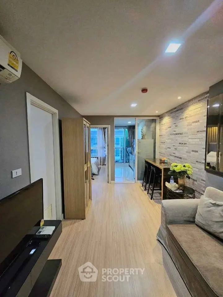 Modern living room with stylish decor and open layout in a contemporary apartment.