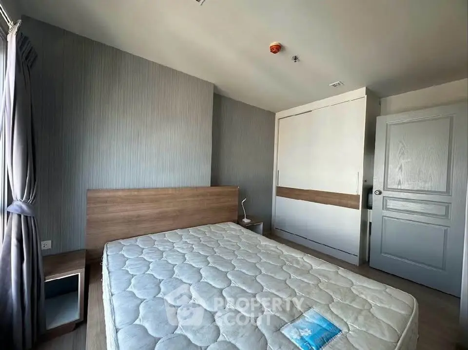 Spacious bedroom with modern design and ample natural light