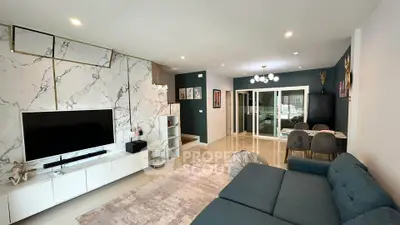 Spacious modern living room with elegant marble accents and stylish furniture