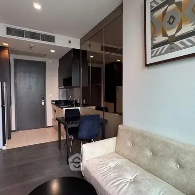 Modern apartment interior with stylish decor and compact kitchen area.