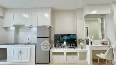 Modern kitchen and living area with sleek design and integrated appliances