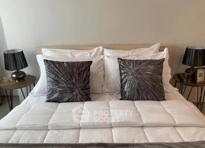 Elegant bedroom with stylish decor and plush bedding, perfect for relaxation and comfort.