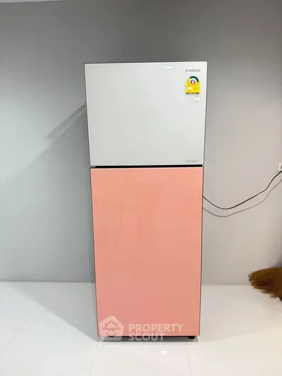 Modern kitchen with stylish Samsung refrigerator in sleek design.