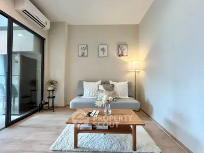 Modern living room with cozy sofa, stylish decor, and air conditioning in a contemporary apartment.