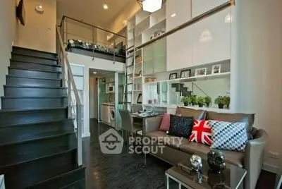 Modern loft-style living room with mezzanine and stylish decor