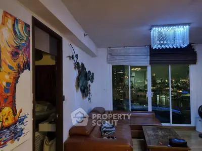 Modern living room with city view, leather sofa, and artistic decor