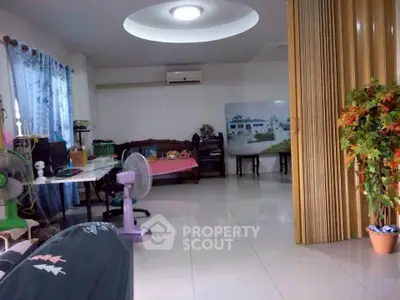 Spacious living room with modern decor and air conditioning