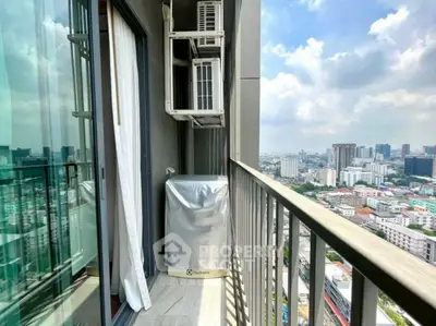 Stunning city view from a high-rise balcony with air conditioning units.
