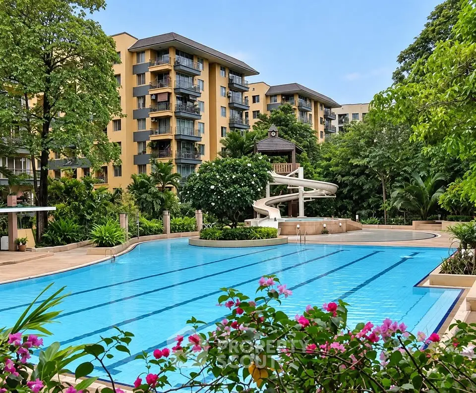 Luxurious residential complex with stunning pool and lush greenery, perfect for relaxation and leisure.