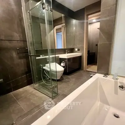 Modern bathroom with glass shower and sleek fixtures