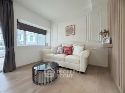 Modern living room with stylish decor and cozy seating area.