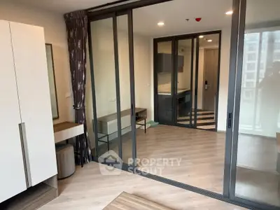 Modern apartment interior with sliding glass doors and stylish decor