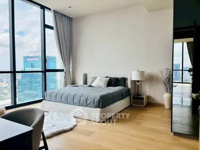 Luxurious bedroom with stunning city view and modern decor