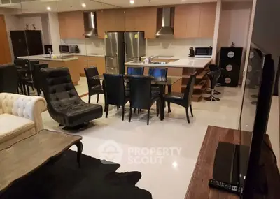 Luxurious open-plan kitchen and living area with modern furnishings and sleek design.