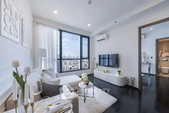 Modern living room with city view, stylish decor, and natural light