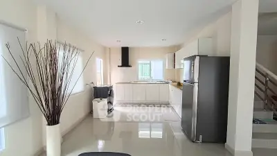 Modern kitchen with sleek appliances and open layout in a bright, spacious home.