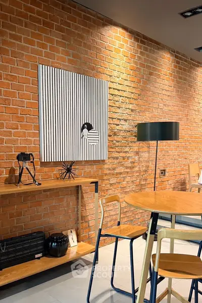 Stylish modern living room with exposed brick wall and contemporary decor