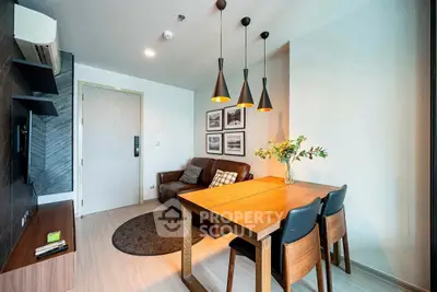 Modern living room with stylish dining area and pendant lights