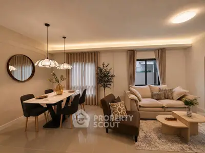 Elegant living room with modern dining area and cozy seating, featuring stylish lighting and decor.