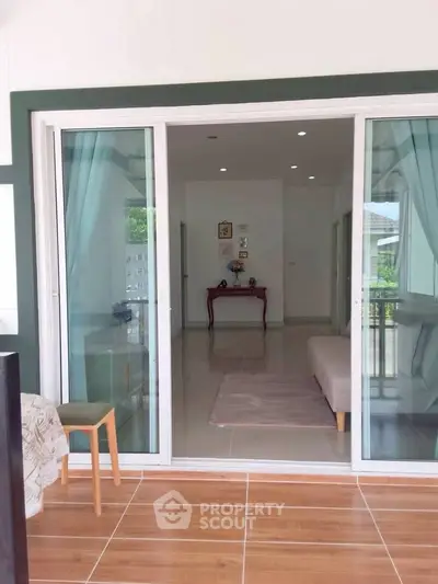 Spacious living room with sliding glass doors and elegant decor