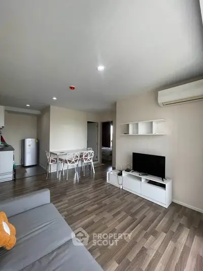 Modern living room with open layout and stylish furniture in a contemporary apartment.