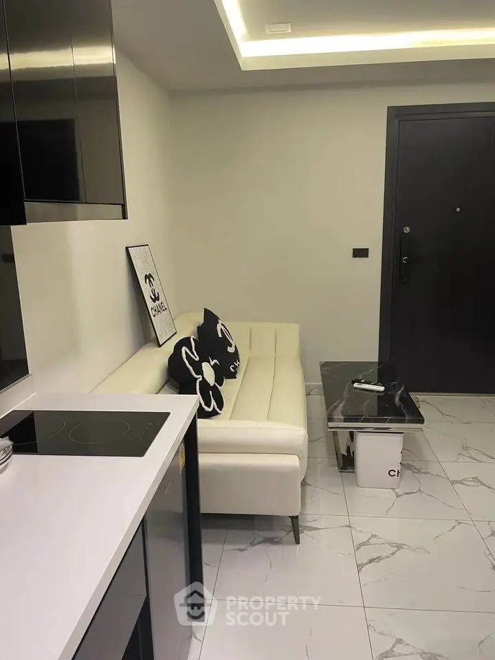 Modern living room with sleek black and white decor and stylish furniture