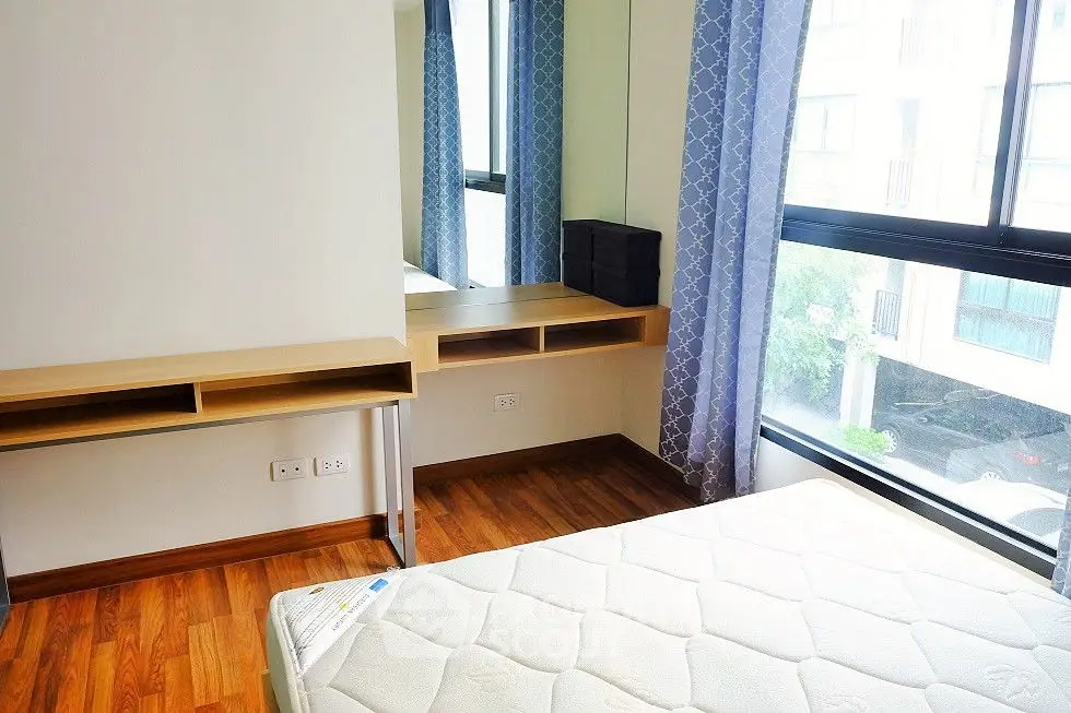 Modern bedroom with slanted windows and stylish decor