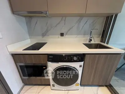 Modern kitchen with integrated appliances and sleek design