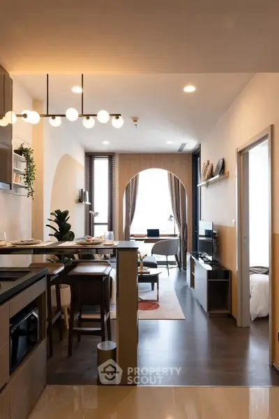 Modern open-plan living room with stylish decor and natural light