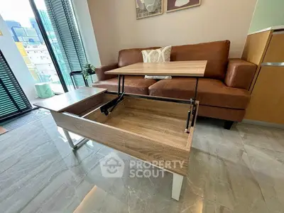 Modern living room with multifunctional coffee table and leather sofa