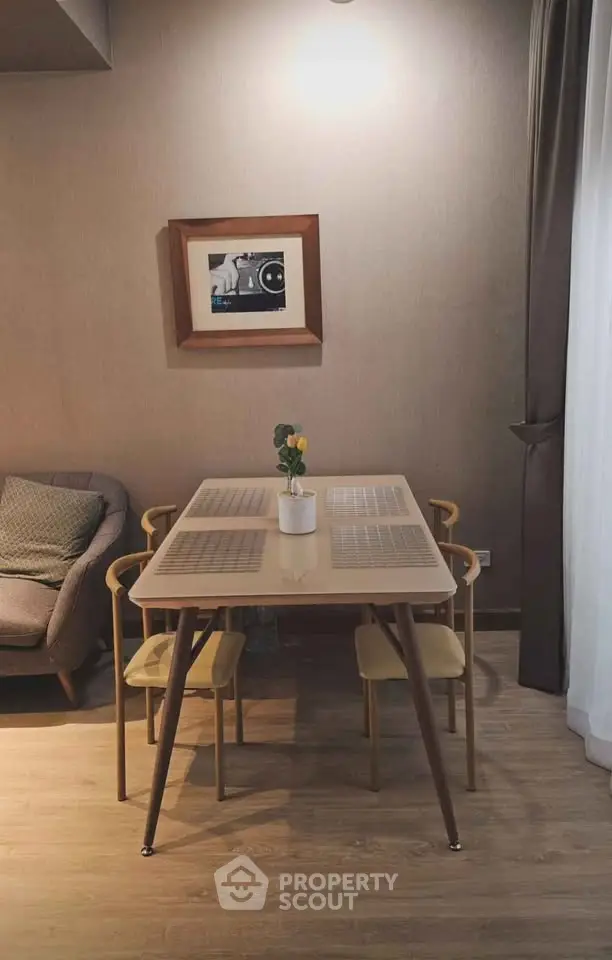 Chic modern living room with stylish dining table and cozy seating area, perfect for urban living.