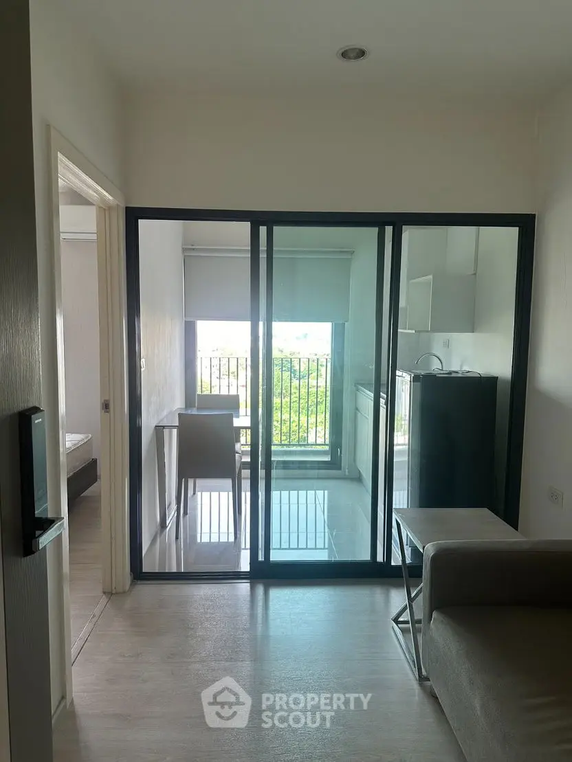 Modern apartment with glass sliding doors and balcony view