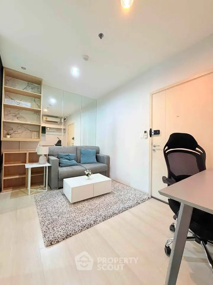 Modern living room with cozy sofa, stylish decor, and sleek furniture in a contemporary apartment.