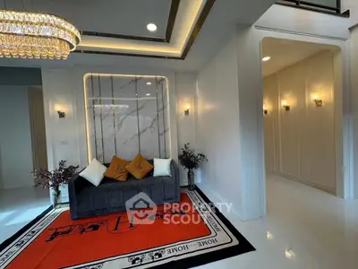 Luxurious living room with elegant chandelier and modern decor