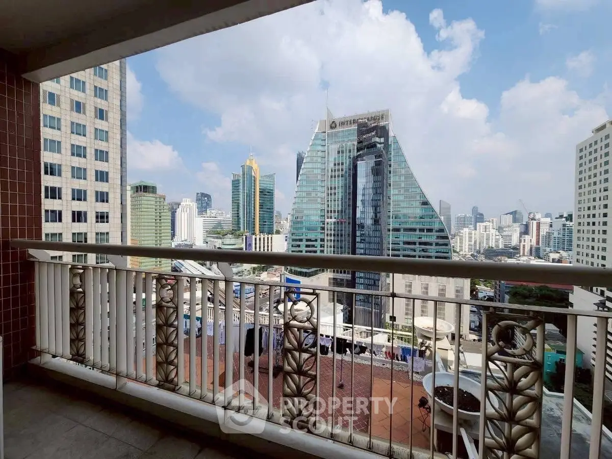 Stunning city view from a spacious balcony in a high-rise building