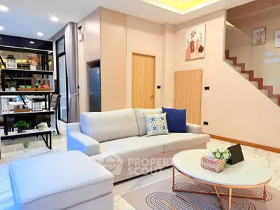 Modern living room with stylish decor and open kitchen layout