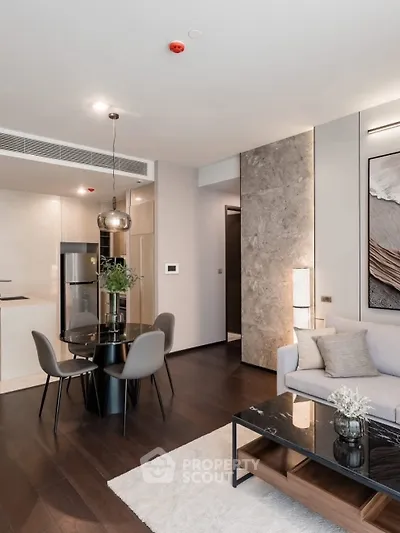 Modern living room with elegant dining area and stylish decor