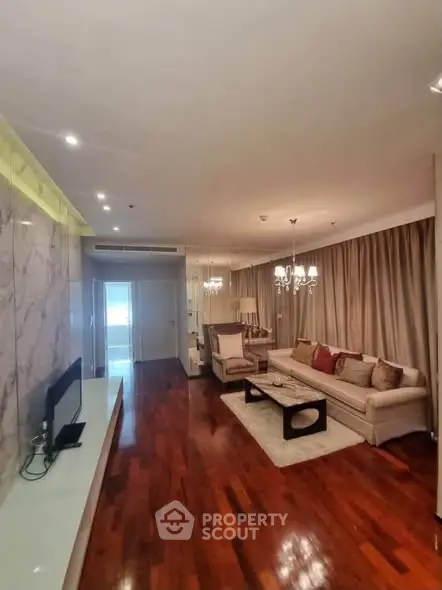 Luxurious living room with elegant decor and hardwood floors in modern apartment.
