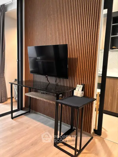 Modern living room with sleek TV stand and stylish wood paneling