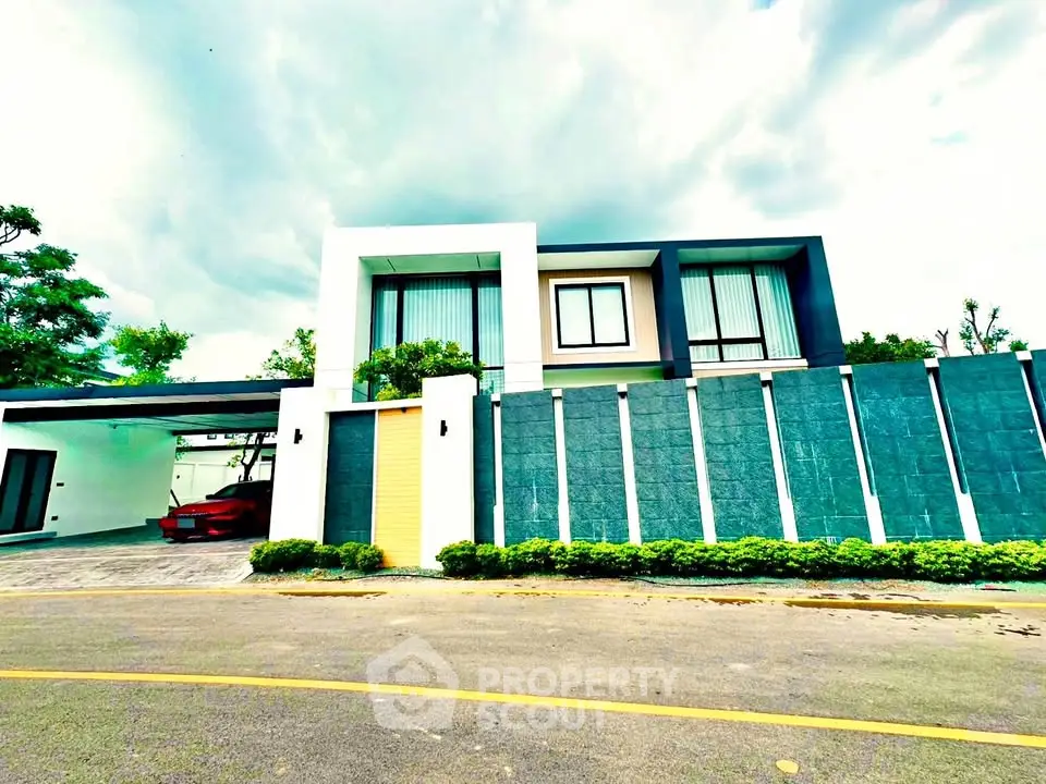 Modern luxury home with sleek design and spacious garage in a serene neighborhood.
