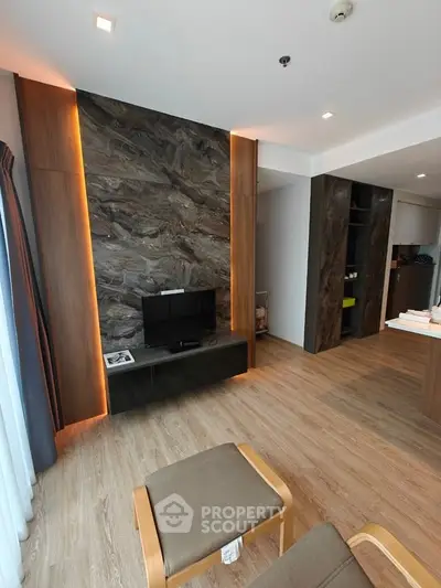 Modern living room with stylish wood paneling and sleek TV setup