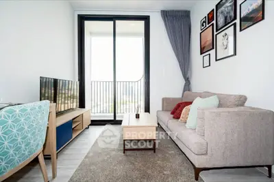 Modern living room with stylish decor and balcony view