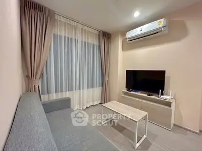 Modern living room with sleek furniture and air conditioning, perfect for cozy relaxation.