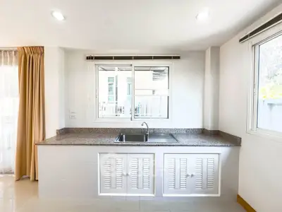 Bright kitchen with large window and modern sink in a spacious layout